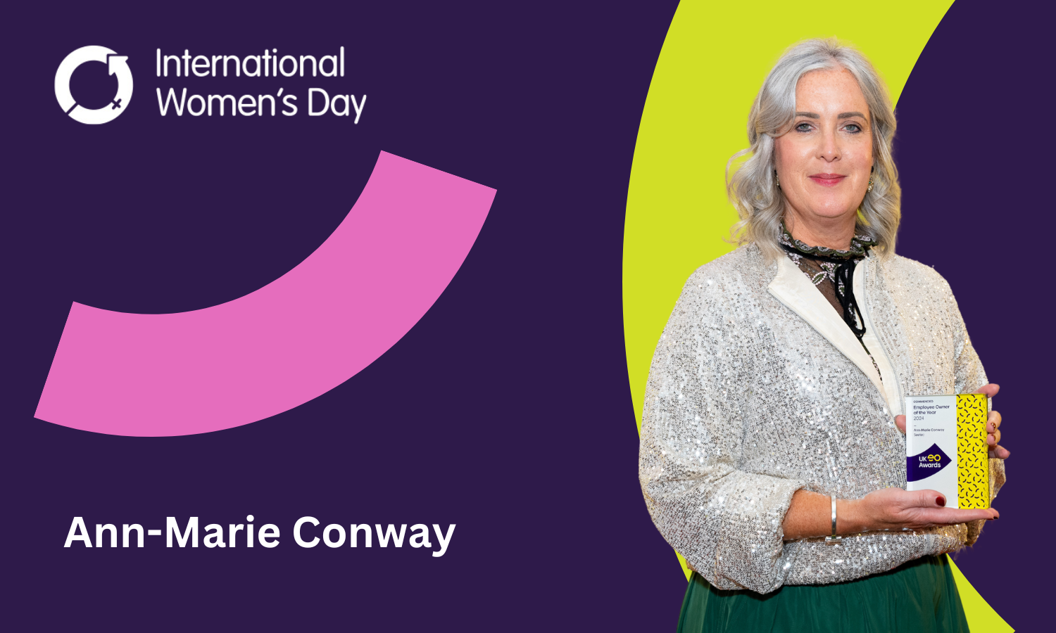 A middle-aged white woman with platinum white hair holding a business award. She is mounted on a purple background alongside the logo for International Women’s Day and the text ‘Ann-Matie Conway’