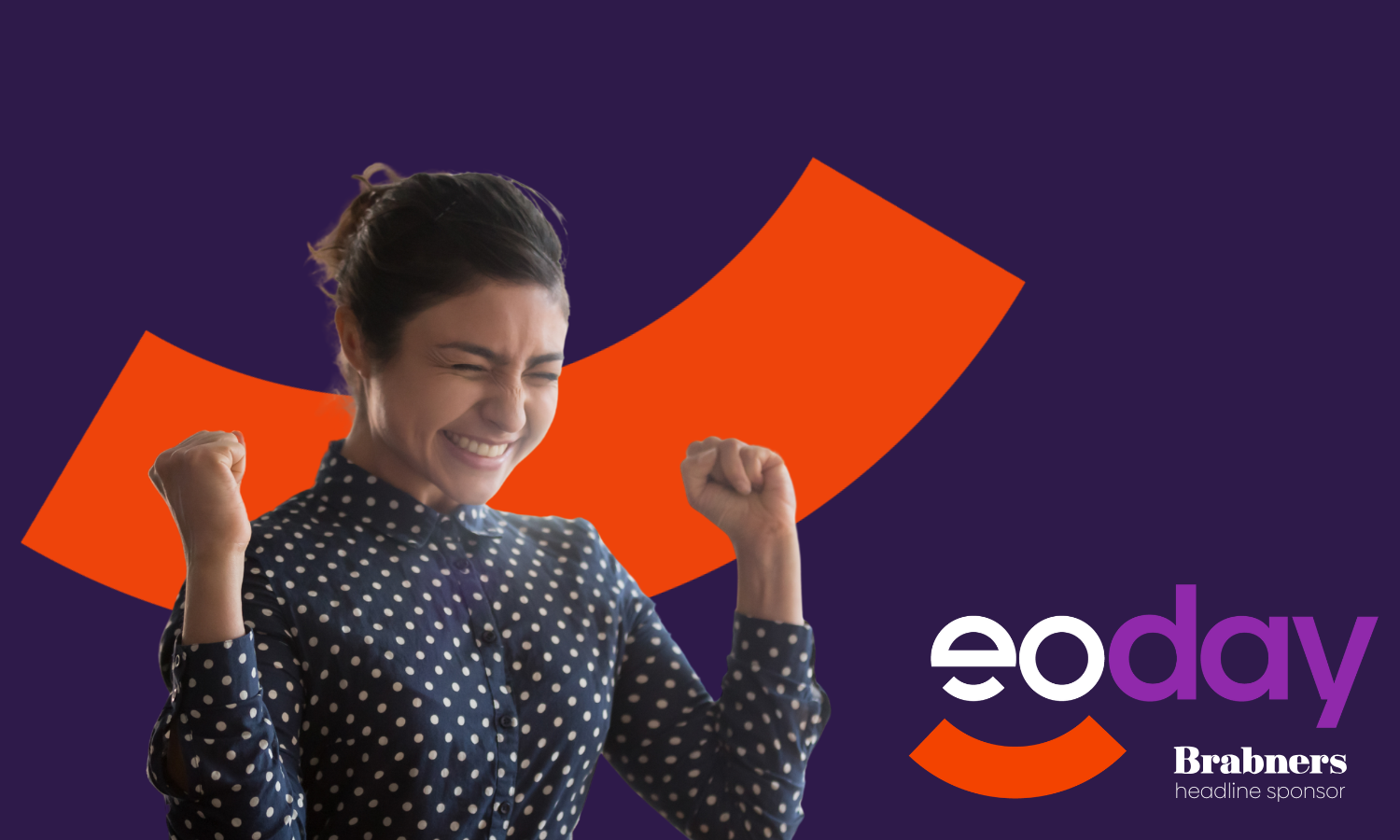 A woman shown from the waist up in a dark polka dot blouse. She has her face screwed up in excitement and has both fists raised. She is mounted on a dark purple background with an orange smile-shaped graphic behind her. The EO Day logo is in the bottom right corner.